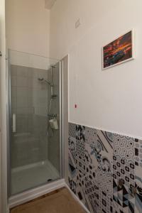 a bathroom with a shower with a glass shower at La Vecchia Dimora in Marrùbiu +26 photos