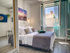 Postel nebo postele na pokoji v ubytování SmartMini Apartments