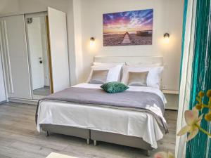 Postel nebo postele na pokoji v ubytování SmartMini Apartments + 2 fotografie