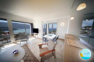 a living room with a view of the ocean at UNE TERRASSE SUR LA MER 3 pers 2 chambres VUE MER in Cassis