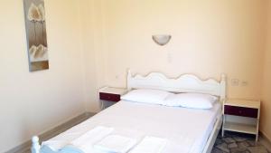 Postel nebo postele na pokoji v ubytování Intos Apartments