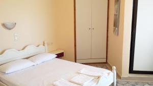 Postel nebo postele na pokoji v ubytování Intos Apartments