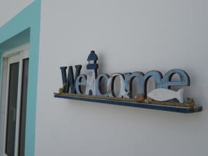 a shelf with a welcome sign on a wall at NÁUTICO Boutique Apartments, by Comfortable Luxury - Adults Only in Corralejo