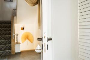 a door with a door knob and a hallway at Liman Hotel Gümüslük - Adult Only in Bodrum City