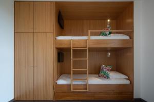 a bunk bed with two beds in a room at Senhora da Rosa, Tradition & Nature Hotel in Ponta Delgada