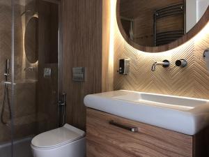 Koupelna v ubytování Apartamenty Forest&Sea + 37 fotografií
