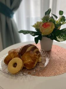 
a plate of donuts on a table at Maison Nilo 15 in Naples

