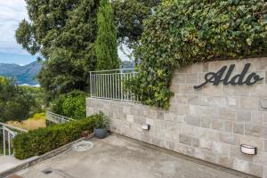 a stone wall with a albid sign on it at Apartments Aldo in Cavtat +16 photos