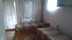 Postel nebo postele na pokoji v ubytování Уютный дом у моря