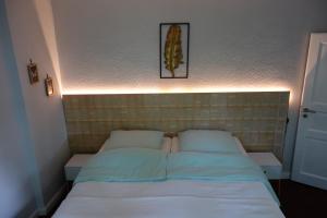 Giường trong phòng chung tại Goldene Feder