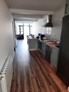 Kuchyň nebo kuchyňský kout v ubytování Apartamentos El Muelle Comillas
