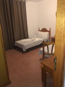 Posteľ alebo postele v izbe v ubytovaní Apartamentos Super