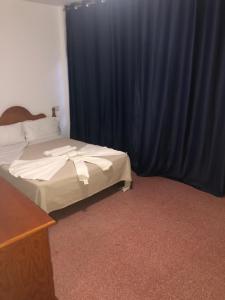 Posteľ alebo postele v izbe v ubytovaní Apartamentos Super
