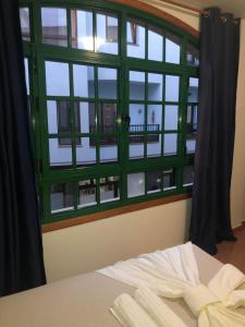 Posteľ alebo postele v izbe v ubytovaní Apartamentos Super