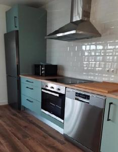 Kuchyň nebo kuchyňský kout v ubytování Apartamentos El Muelle Comillas
