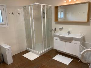 a bathroom with a shower and a sink at le Garden Cocoon in Istres