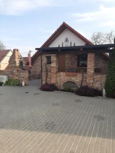 a brick house with a brick driveway at Apartment U Pavelků in Mutěnice