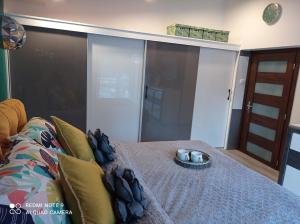 Posteľ alebo postele v izbe v ubytovaní Apartamenty Sowianka