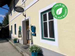 a shop with a sign on the side of a building at Haus 26 Weißbriach in Weissbriach