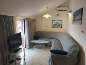 En eller flere senger på et rom på Apartments & Rooms Nensi