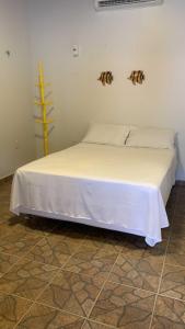 Uma cama ou camas num quarto em SOLAR DA BRAN Mosqueiro - Pará