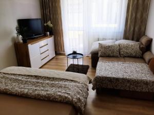 Posteľ alebo postele v izbe v ubytovaní Apartmán Hanka