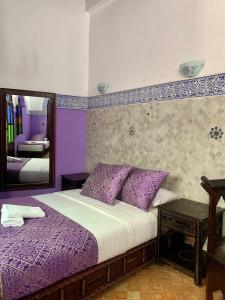 Ένα ή περισσότερα κρεβάτια σε δωμάτιο στο Riad Zahraa Al Ismailia