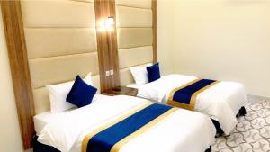 Postel nebo postele na pokoji v ubytování Golden Inn