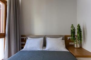 
Ένα ή περισσότερα κρεβάτια σε δωμάτιο στο Agora Suites

