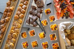a bunch of different types of food on a table at Best Western Plus Sabaudia Hotel in Sabaudia
