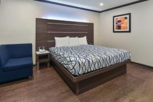 Ένα ή περισσότερα κρεβάτια σε δωμάτιο στο Oak Park Motel