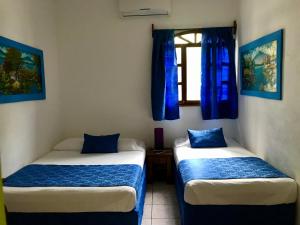Postel nebo postele na pokoji v ubytování HC Liri Hotel