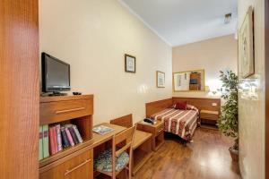Postel nebo postele na pokoji v ubytování Buonarroti Home