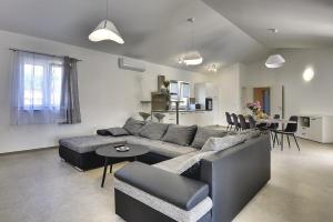 a living room with a couch and a table at Villa Lu in Vodnjan