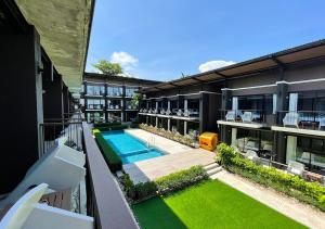 an aerial view of a building with a swimming pool at La Lune Beach Resort in Ko Samed