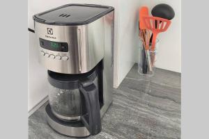a coffee maker sitting on top of a counter at Appartement neuf vue Marina étang Z'abricot FDF in Fort-de-France