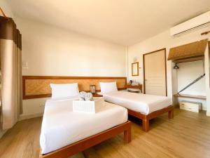 Postel nebo postele na pokoji v ubytování Samed Cabana Resort