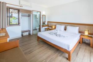 Postel nebo postele na pokoji v ubytování Samed Cabana Resort