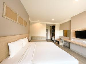 Postel nebo postele na pokoji v ubytování Rayong Chalet Resort
