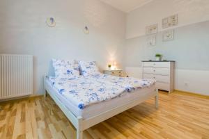 Postel nebo postele na pokoji v ubytování Przytulny Apartamencik