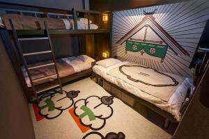 Postel nebo postele na pokoji v ubytování HOTEL TAVINOS Kyoto