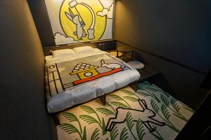 Postel nebo postele na pokoji v ubytování HOTEL TAVINOS Kyoto