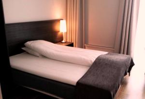 Postel nebo postele na pokoji v ubytování Bryne Hotell