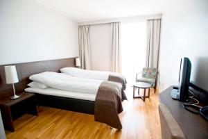 Postel nebo postele na pokoji v ubytování Bryne Hotell