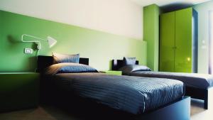 Postel nebo postele na pokoji v ubytování La Scivola Rooms