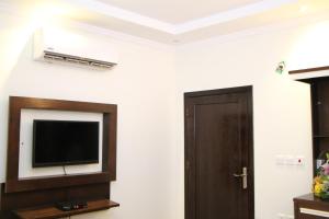 TV a/nebo společenská místnost v ubytování Al Muhaidb Residence Al Dowally