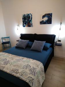 Postel nebo postele na pokoji v ubytování B&B Alghero Reina