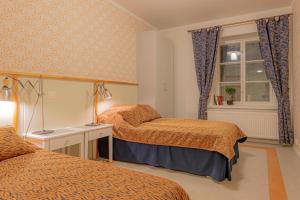 En eller flere senger på et rom på Hotelli Verstas