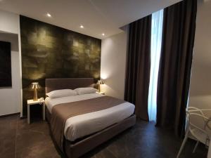 Postel nebo postele na pokoji v ubytování Hotel Up Wellness & Spa
