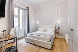Posteľ alebo postele v izbe v ubytovaní Migliori Collection Apartment